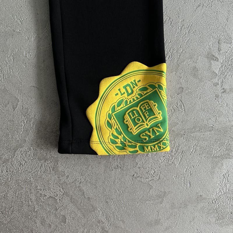 Conjunto Syna World College Logo Preto/Amarelo - HYPER LIST