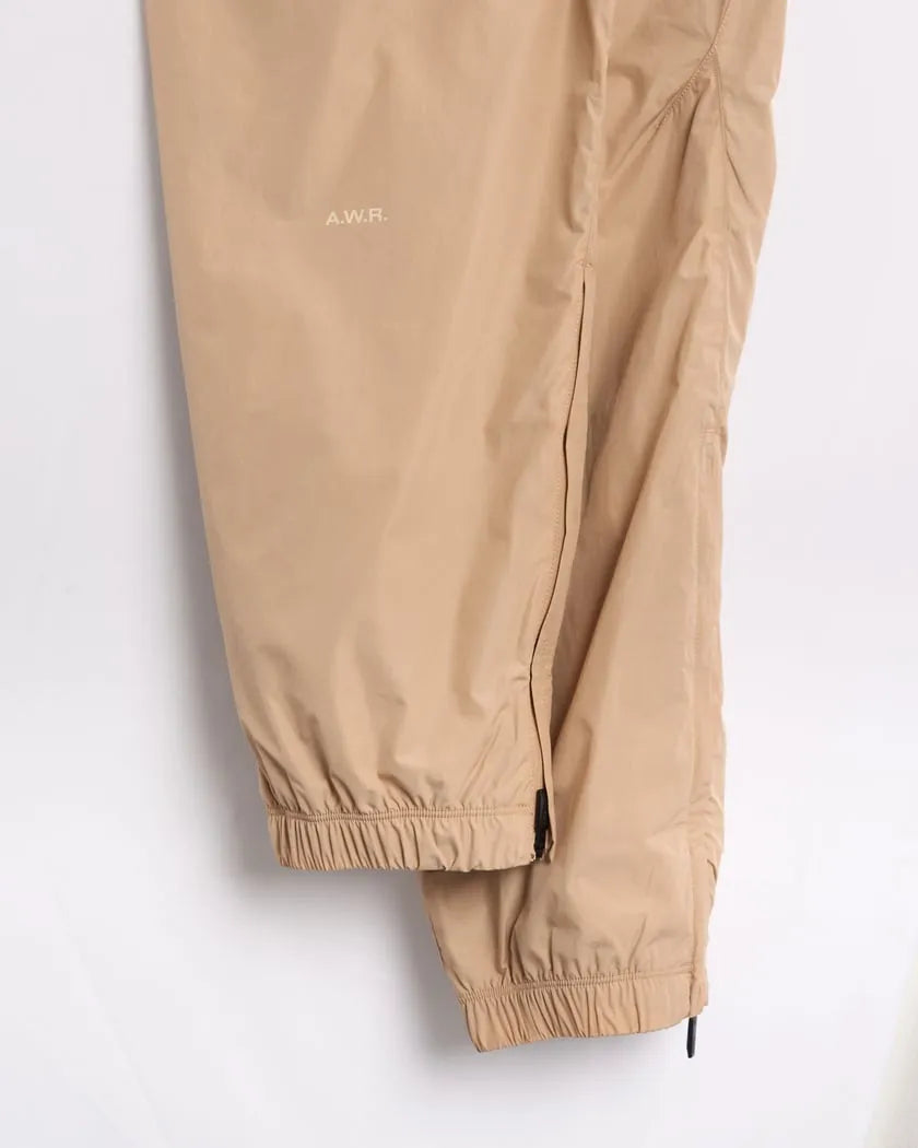 Conjunto Nike x NOCTA Woven Track Bege Areia/Marrom Claro - HYPER LIST